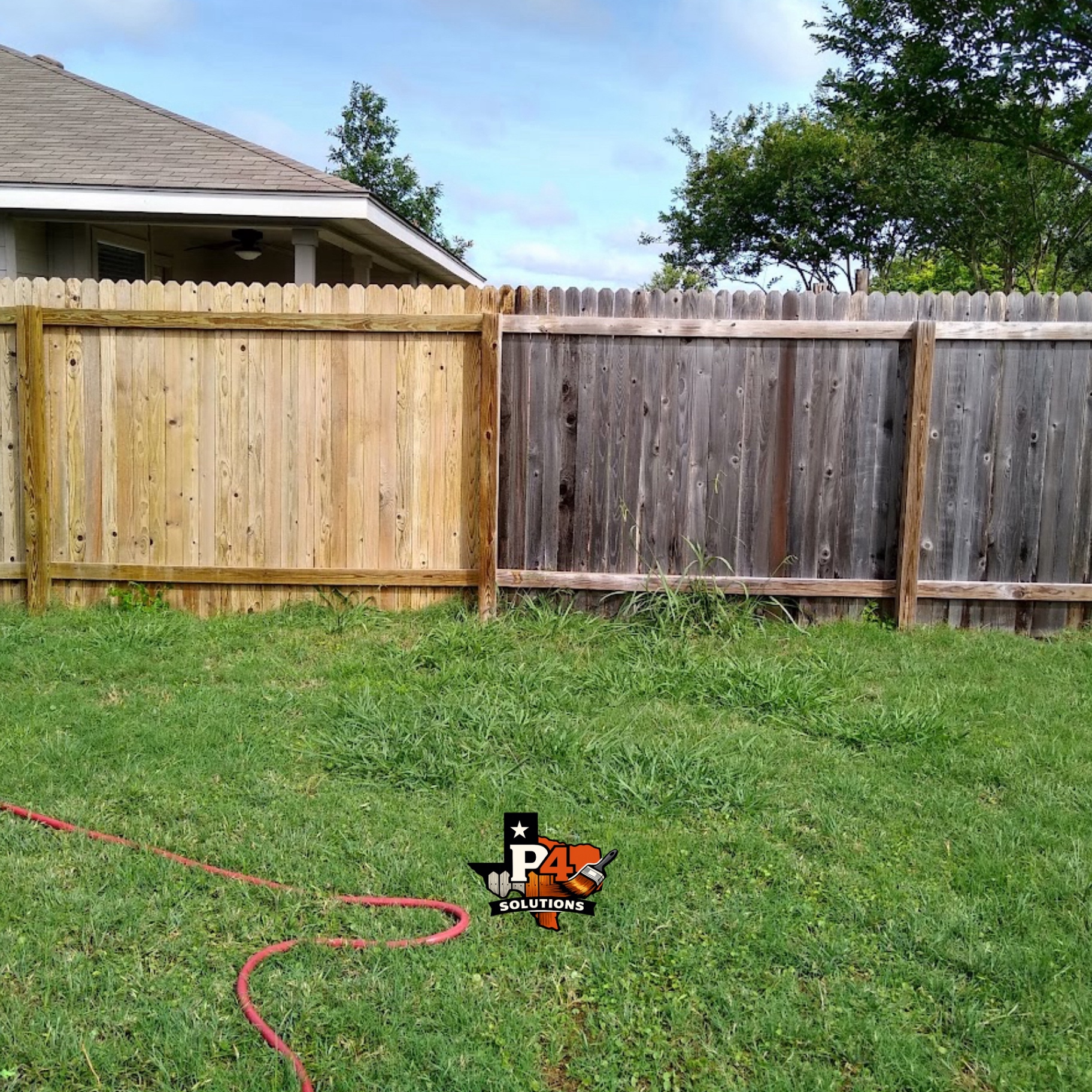 Cleaned and restored fence panels next to grey weathered panels