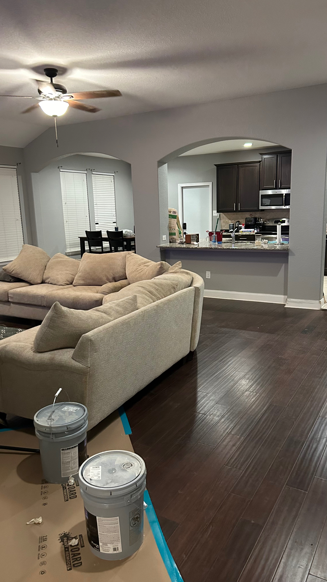 Freshly painted living room in soft grey with vaulted ceiling